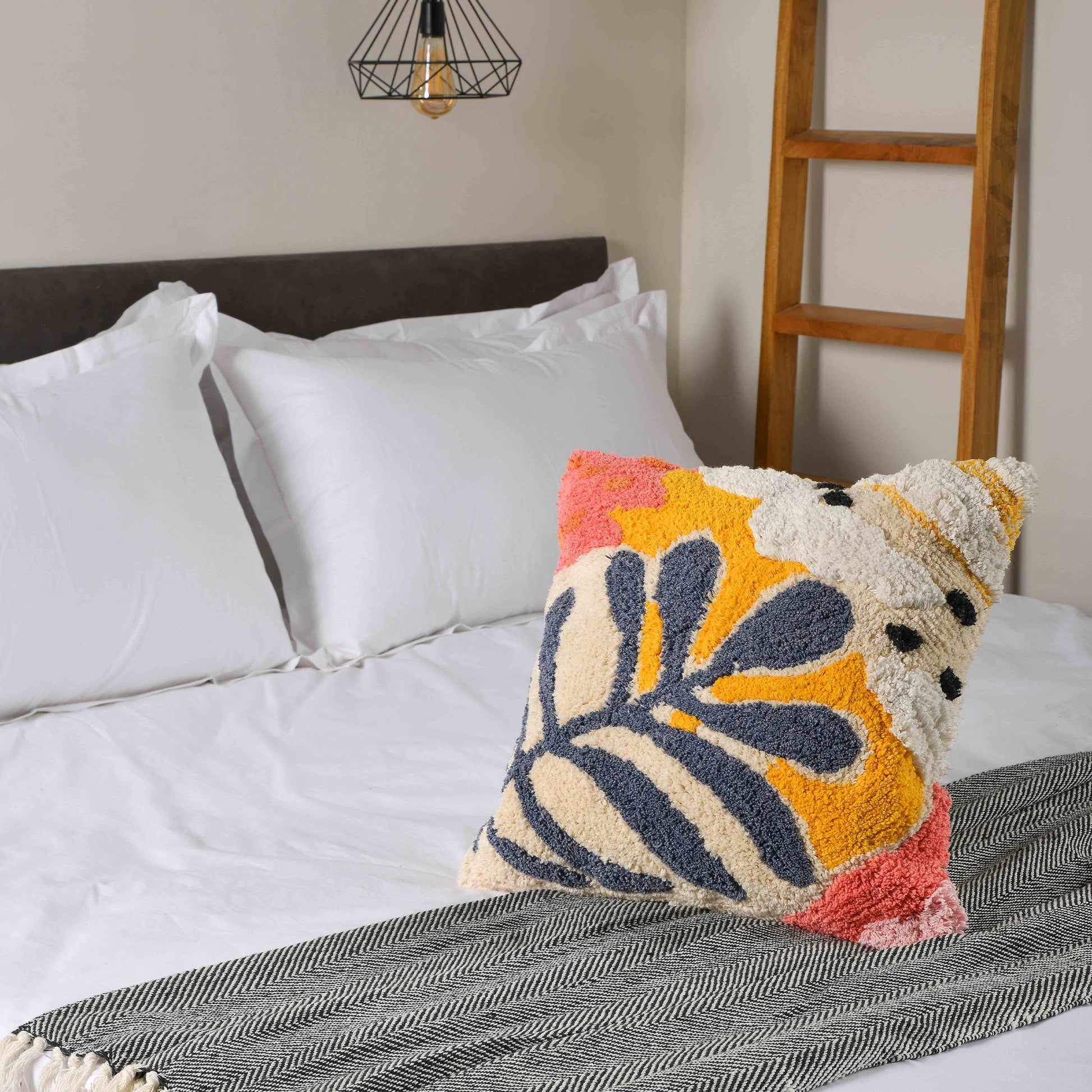 Cushion cover photoshoot in a airbnb. Beautiful design with different combination of colors. Yellow, White, Blue, Pink and Orange.Leaf kind of design.